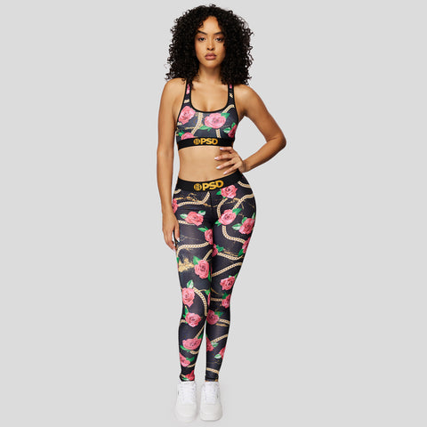 woman wearing sports bra and women's leggings set with gold chain and rose design | PSD New Zealand